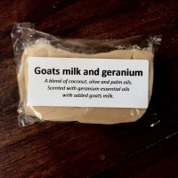 Picture of the goat's milk and geranium soap in its cellophane packaging